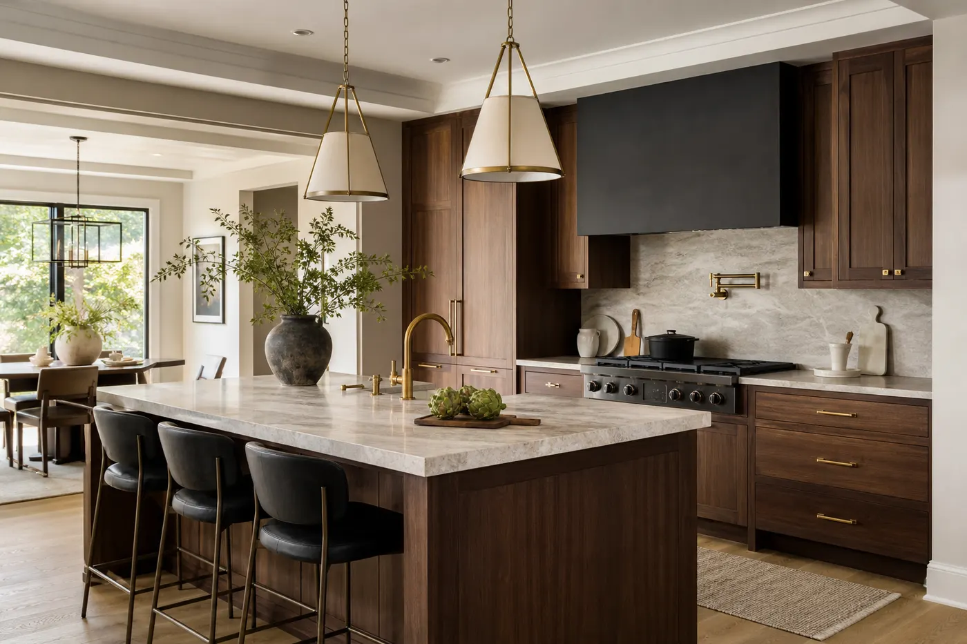 Warm walnut kitchen remodel with stone countertops and brass details